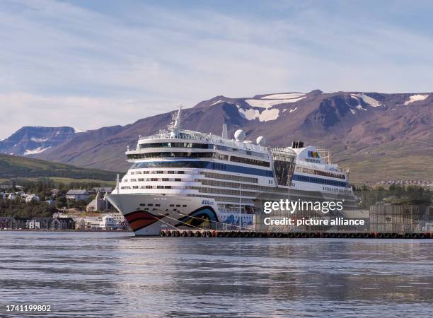 August 2023, Iceland, Akureyri: The cruise ship "AIDALuna" is in the port of Eyjafjördur fjord. Photo: Soeren Stache/dpa
