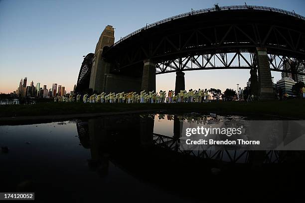 Falun Gong Practitioners meditate on the 14th anniversary of the beginning of the persecution of Falun Gong in China on July 21, 2013 in Sydney,...