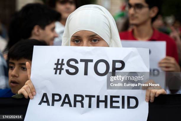 Person holds a sign during a demonstration organized by BDS Pais Valenciano, at the Plaza del Ayuntamiento, on October 17 in Valencia, Valencia,...