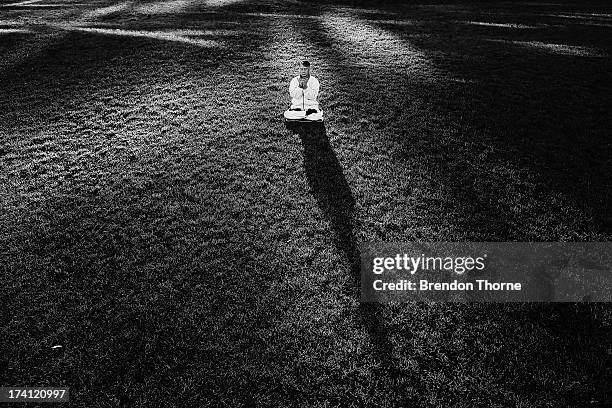 Falun Gong Practitioner poses on the 14th anniversary of the beginning of the persecution of Falun Gong in China on July 21, 2013 in Sydney,...