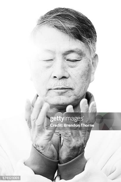 Falun Gong Practitioner poses on the 14th anniversary of the beginning of the persecution of Falun Gong in China on July 21, 2013 in Sydney,...