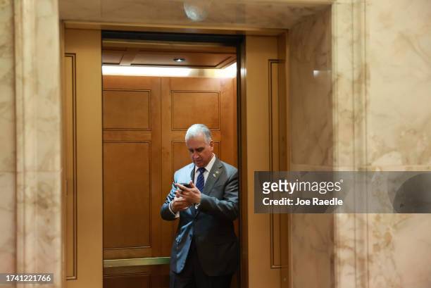 Rep. Mario Díaz-Balart boards an elevator after the House of Representatives failed to elect a new Speaker of the House on the first round of votes...