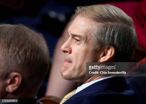 Rep. Jim Jordan listens to nomination speeches for Speaker of the House as the House of Representatives prepares to vote on a new Speaker at the U.S....