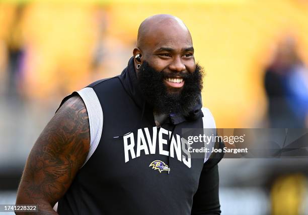 Morgan Moses of the Baltimore Ravens warms up prior to the game against the Pittsburgh Steelers at Acrisure Stadium on October 8, 2023 in Pittsburgh,...