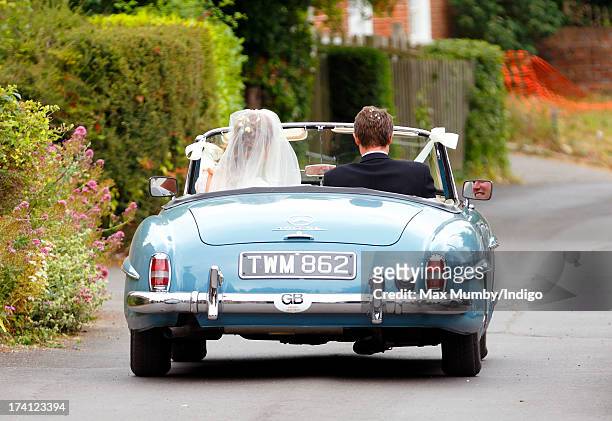 Alicia Fox-Pitt and Sebastian Stoddart leave The Church of the Holy Cross in an open-top Mercedes car after their wedding in Goodnestone on July 20,...