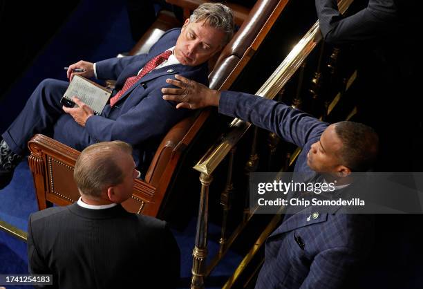 Rep. Andy Ogles is touched by Rep. John James after he voted against Rep. Jim Jordan for Speaker as the House of Representatives works to elect a new...