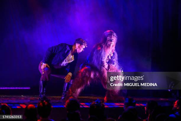 Dancers perform, one as Chewbacca, in "The Empire Strips Back", a burlesque parody of Star Wars at the Marie-Bell gymnasium theatre in central Paris...