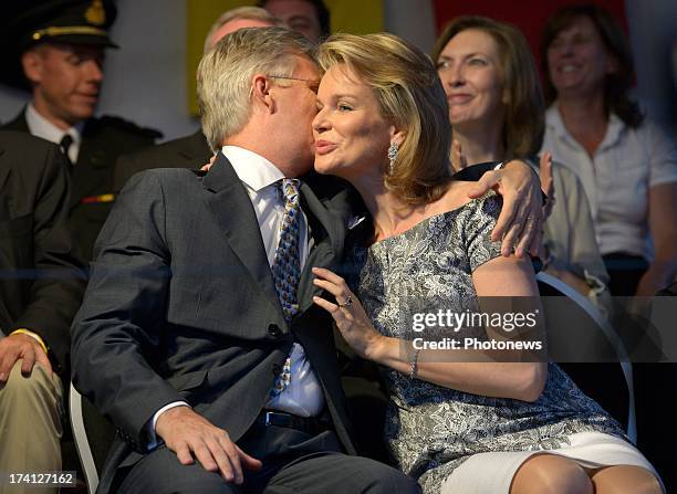 Prince Philippe of Belgium and Princess Mathilde of Belgium kiss each other on the cheek as they attend an evening of concerts the 'Bal National' in...