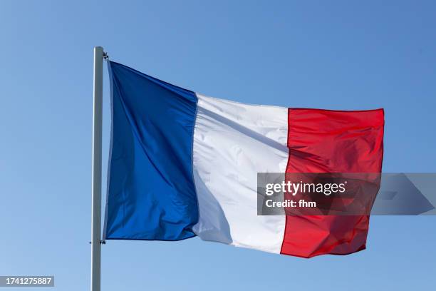 french national flag with blue sky - french flag stock pictures, royalty-free photos & images