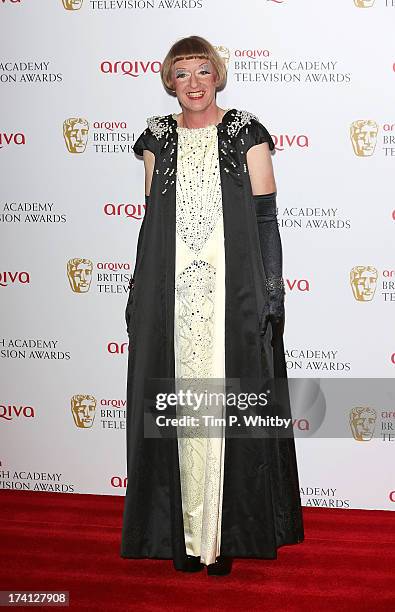 Grayson Perry poses in the press room at the Arqiva British Academy Television Awards 2013 at the Royal Festival Hall on May 12, 2013 in London,...