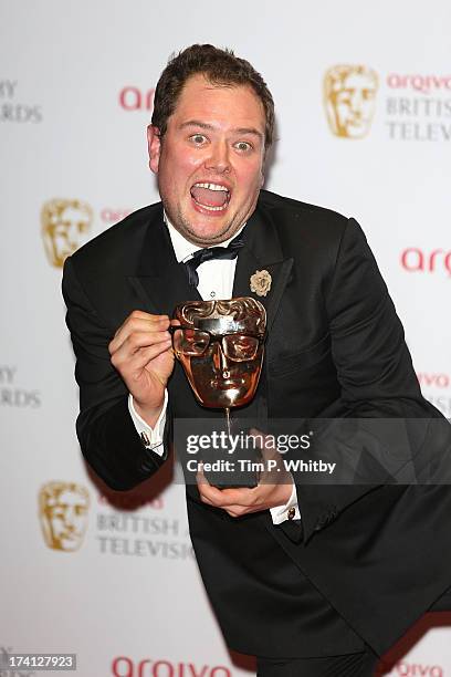 Alan Carr poses with his award for Best Entertainment Performance in the press room at the Arqiva British Academy Television Awards 2013 at the Royal...