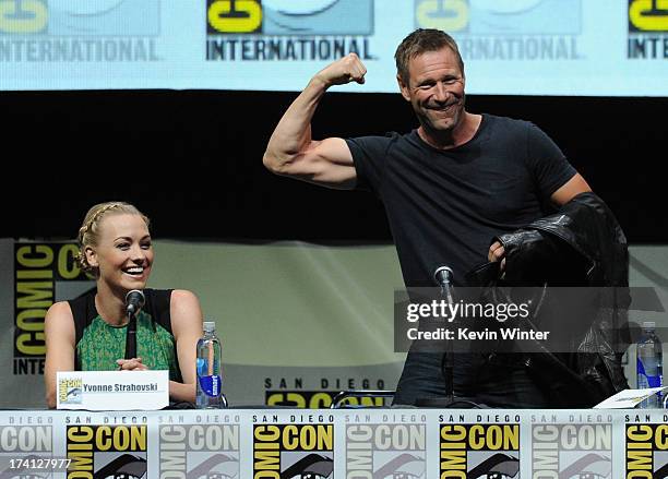 Actress Yvonne Strahovski and actor Aaron Eckhart speaks onstage at the Lionsgate preview featuring "I, Frankenstein" and "The Hunger Games: Catching...