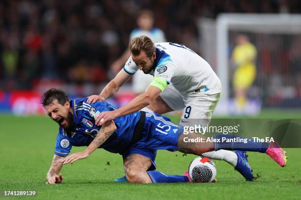 Francesco Acerbi of Italy is challenged by Harry Kane of England during the UEFA EURO 2024 European qualifier match between England and Italy at...