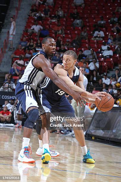 Brandon Triche of the Charlotte Bobcats protects the ball during NBA Summer League game between the D League Select and the Charlotte Bobcats on July...