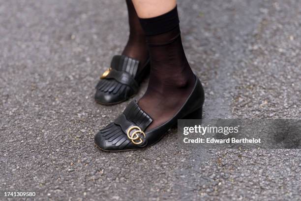 Emy Venturini wears black mesh socks from Calzedonia, black leather shoes from Gucci, during a street style fashion photo session, on October 17,...