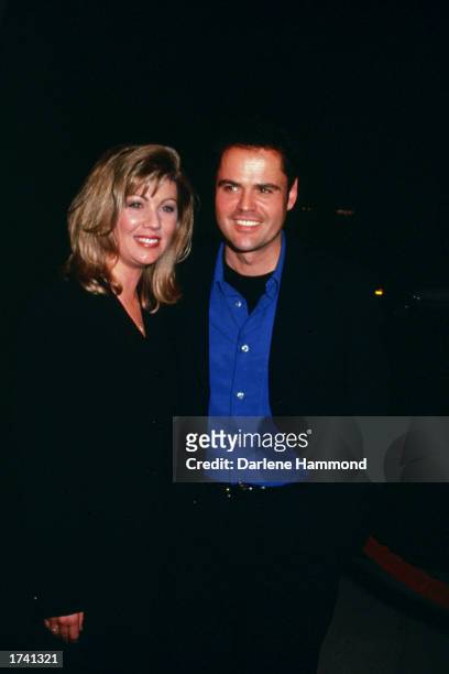 American singer and actor Donny Osmond and wife, Debbie, attend the premiere of the film, 'Meet Joe Black,' at the Academy Theatre in Los Angeles,...