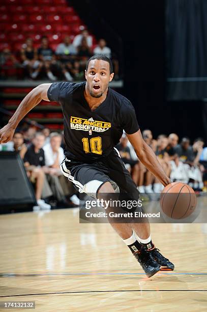 Michael Snaer of the Los Angeles Lakers drives up court during NBA Summer League game between the Golden State Warriors and the Los Angeles Lakers on...