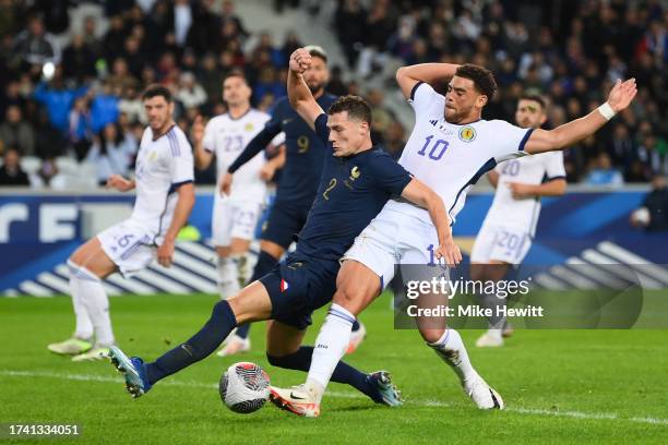 Benjamin Pavard of France misses a chance whilst under pressure by Che Adams of Scotland during the International Friendly between France and...