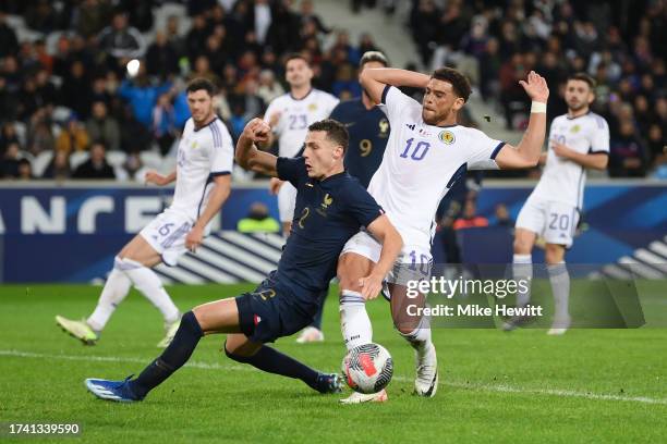 Benjamin Pavard of France is fouled in the box by Che Adams of Scotland which leads to a France penalty during the International Friendly between...