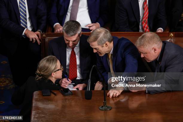 Rep. Jim Jordan talks with staff and fellow lawmakers as the House of Representatives meets to elect a new Speaker of the House at the U.S. Capitol...