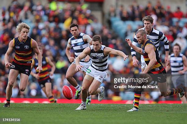 Joel Selwood of the Cats attempts to win the ball during the round 17 AFL match between the Adelaide Crows and the Geelong Cats at AAMI Stadium on...