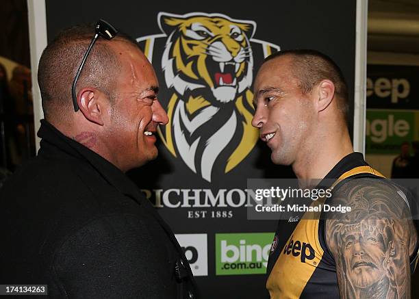 Jake King of the Tigers meets the father of Dustin Martin, Shane Martin, after the round 17 AFL match between the Richmond Tigers and the Fremantle...