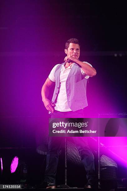 Degrees singer Nick Lachey performs during "The Package Tour" with Boyz II Men and New Kids On The Block at Target Center on July 20, 2013 in...