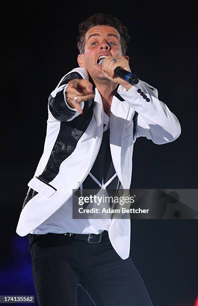 New Kids On The Block singer Joey McIntyre performs during "The Package Tour" with 98 Degrees And Boyz II Men at Target Center on July 20, 2013 in...