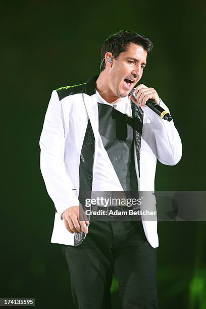 New Kids On The Block singer Jonathan Knight performs during "The Package Tour" with 98 Degrees And Boyz II Men at Target Center on July 20, 2013 in...