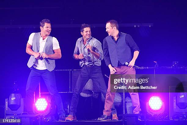 Degrees Nick Lachey, Justin Jeffre and Jeff Timmons perform during "The Package Tour" with Boyz II Men and New Kids On The Block at Target Center on...