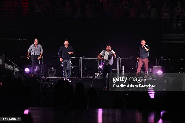 Degrees Drew Lachey, Nick Lachey, Justin Jeffre and Jeff Timmons perform during "The Package Tour" with Boyz II Men and New Kids On The Block at...