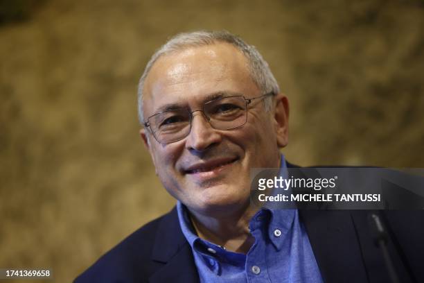 Exiled Russian former oligarch and now opposition figure Mikhail Khodorkovsky reacts during a talk and book presentation of his new book "How Do You...