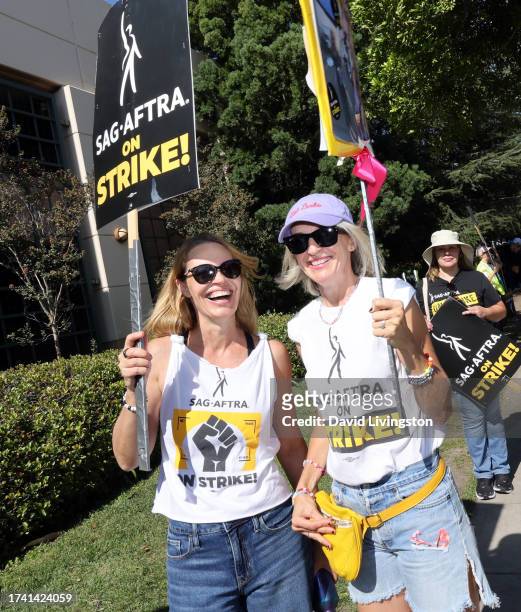 Jeri Ryan and Ever Carradine join the picket line outside Warner Bros. Studios on October 17, 2023 in Burbank, California. SAG-AFTRA has been on...