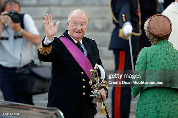 Queen Paola and King Albert II of Belgium are seen in front of the Cathedral of St Michael and Saint Gudula prior to the Abdication Of King Albert II...