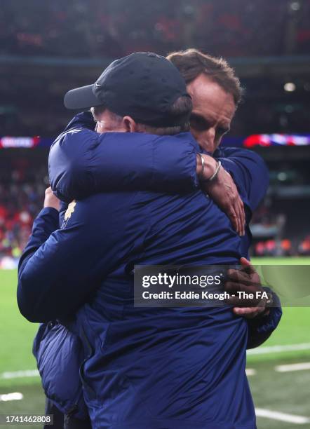 Gareth Southgate celebrates with Steve Holland, Assistant Manager of England, after the team's victory during the UEFA EURO 2024 European qualifier...