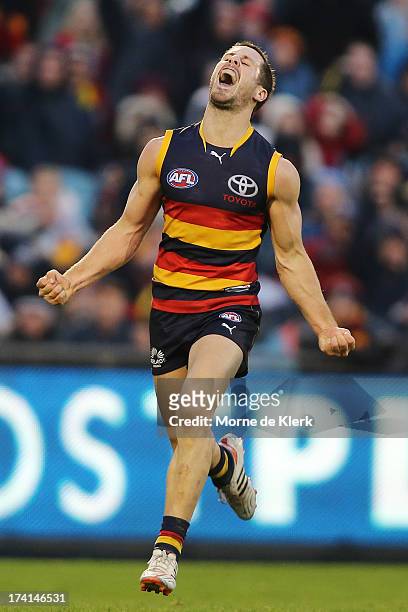 Matthew Wright of the Crows celebrates after kicking a late goal during the round 17 AFL match between the Adelaide Crows and the Geelong Cats at...