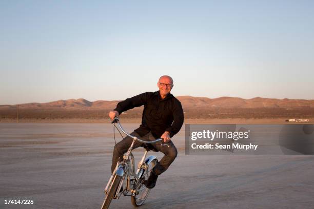 man on bike in desert - lancaster california stock pictures, royalty-free photos & images