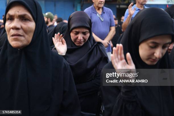 Mourners attend the funeral of a fighter with the Lebanese Shiite movements Hezbollah, who was killed in clashes with Israel, during his funeral in...