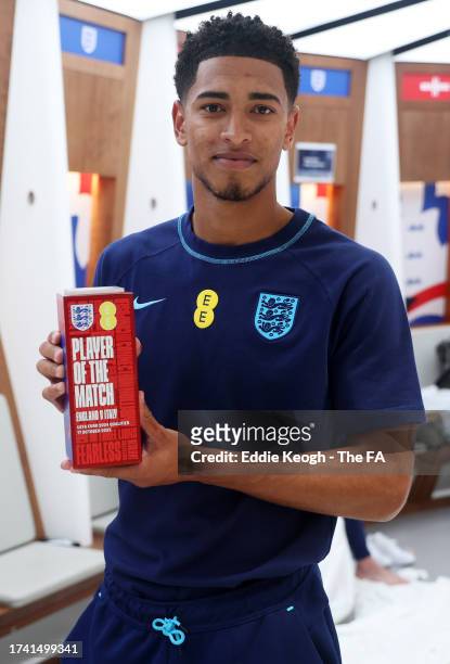 Jude Bellingham of England poses for a photo with the Player Of The Match award in the dressing room after the team's victory during the UEFA EURO...
