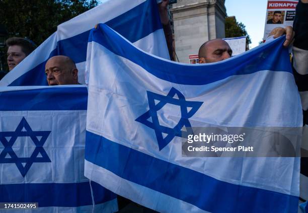 Supporters of both Palestine and Israel face off in dueling protests at Washington Square Park on October 17, 2023 in New York City. The protest,...