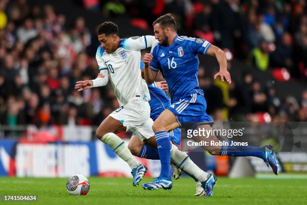 Jude Bellingham of England and Bryan Cristante of Italy during the UEFA EURO 2024 European qualifier match between England and Italy at Wembley...