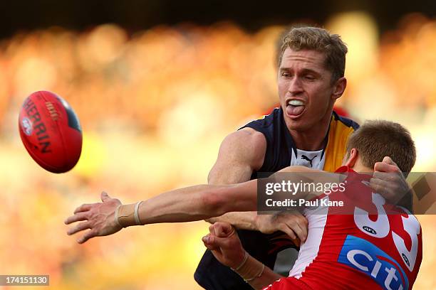 Adam Selwood of the Eagles and Brandon Jack of the Swans contest for the ball during the round 17 AFL match between the West Coast Eagles and the...