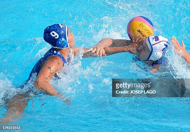 Uzbekistan's Aleksandra Sarancha fights for the ball by Russia's Ekaterina Tankeeva during the preliminary rounds of the women's water polo...