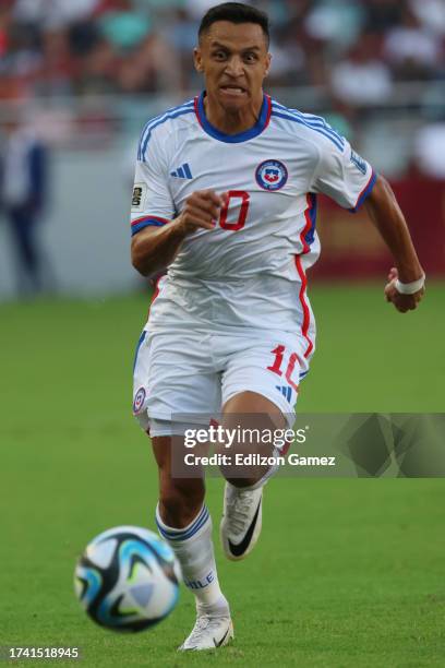 Alexis Sanchez of Chile runs with the ball during the FIFA World Cup 2026 Qualifier match between Venezuela and Chile at Estadio Monumental de...