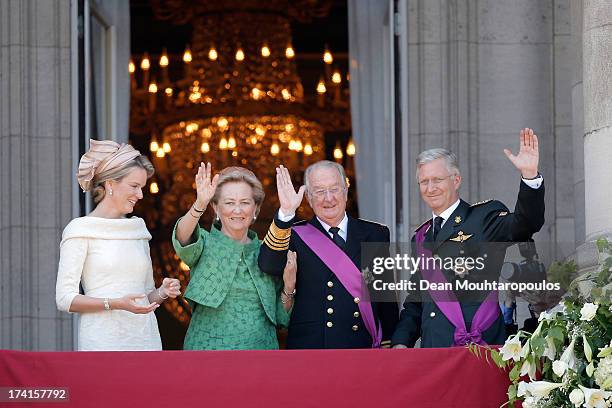 Queen Mathilde of Belgium, Princess Paola of Belgium, King Albert II of Belgium and King Philippe of Belgium are seen greeting the audience from the...