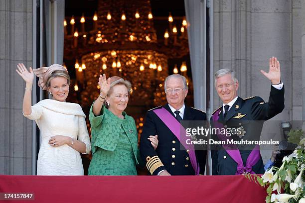 Queen Mathilde of Belgium, Princess Paola of Belgium, King Albert II of Belgium and King Philippe of Belgium are seen greeting the audience from the...