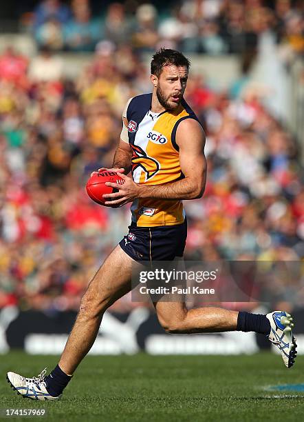 Mitchell Brown of the Eagles looks to pass the ball during the round 17 AFL match between the West Coast Eagles and the Sydney Swans at Patersons...