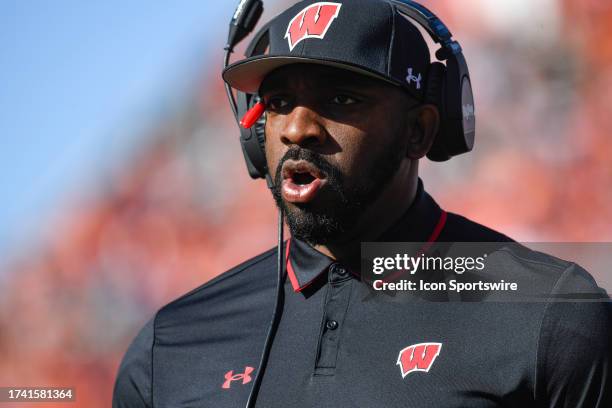 Wisconsin Badgers Defensive Line Coach Greg Scruggs looks on during the college football game between the Wisconsin Badgers and the Illinois Fighting...