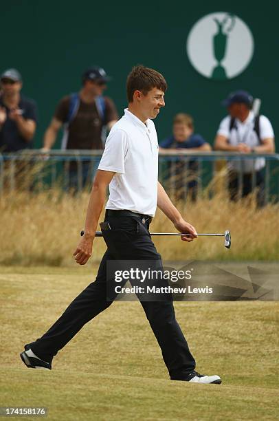 Matthew Fitzpatrick of England smiles on the 18th green during the final round of the 142nd Open Championship at Muirfield on July 21, 2013 in...