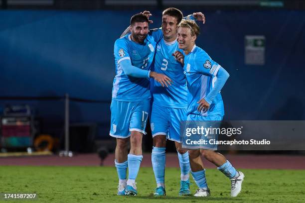 Golinucci Alessandro of San Marino celebrates after scoring his team's first goal with his teammates Tosi Alessandro and Lazzari Lorenzo during the...